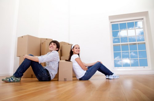 Packed moving boxes and furniture ready for transport