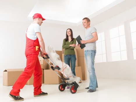 Local moving team with a van in a residential Alperton street