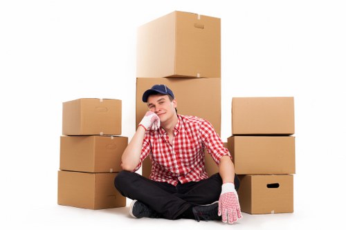Packed moving boxes and furniture ready for transport in an Alperton home
